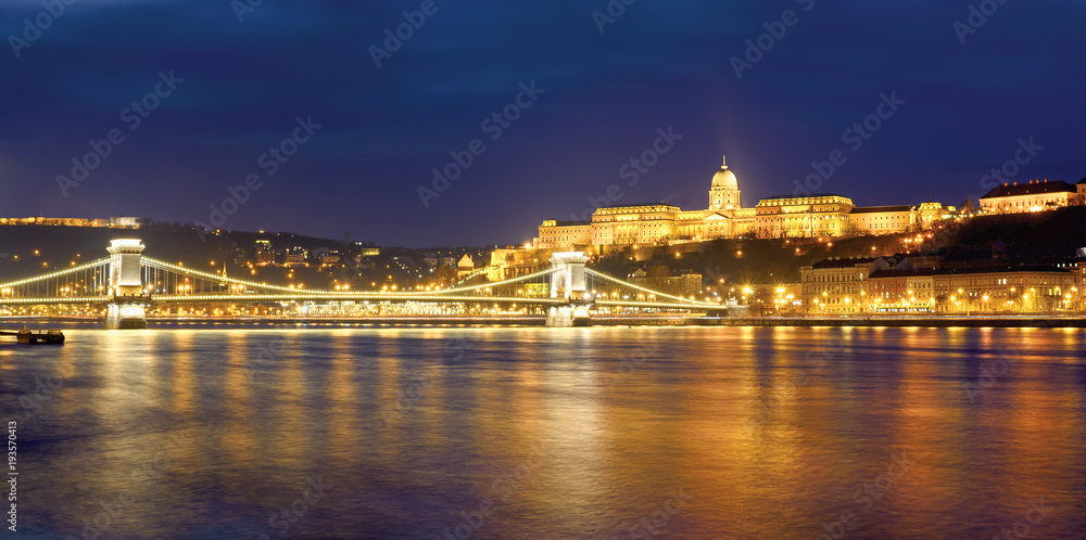 Chain bridge and Royal Palace in Budapest , night panorama