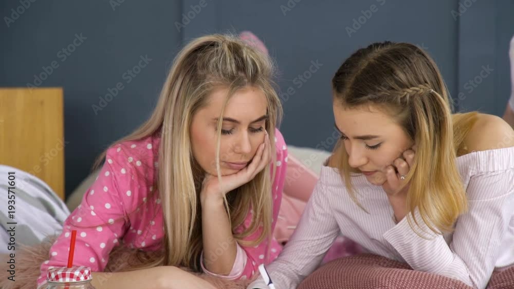 friendship bff. fun leisure pastime. friends communication. young teenage mates at home drawing in the notebook friendship bff. fun leisure pastime. friends communication. young teenage mates at home drawing in the notebook
