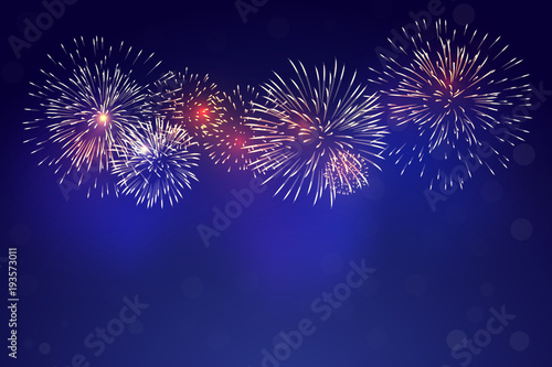 brightly colorful fireworks with pale smoke from fire on twilight background