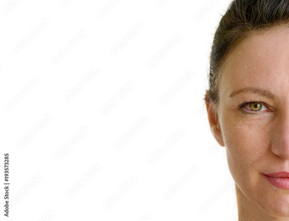 Obraz premium Half face portrait of an attractive brunette