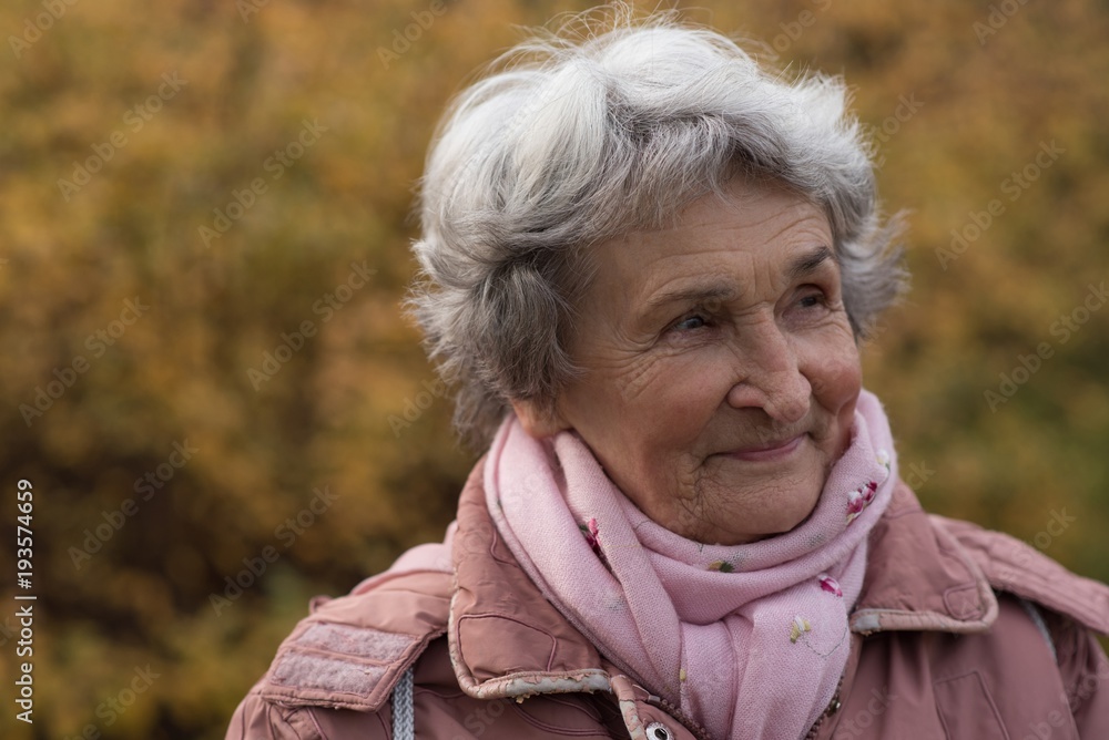 Senior woman in warm clothing outdoors Senior woman in warm clothing outdoors
