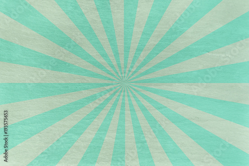 Aqua and mint green slate background - with retro starburst in alternating stripes - abstract pastel stone background