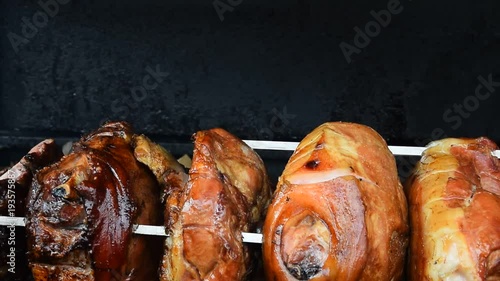 Close up pork meat roasted on open wood fire