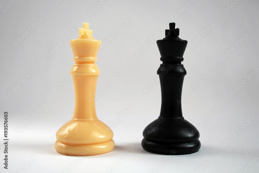 Chess figure, business concept strategy, leadership, team and success. Pair of king chess peaces confronted as opposites.leadership, confidence and imagination concept. Chess figure, business concept strategy, leadership, team and success. Pair of king chess peaces confronted as opposites.leadership, confidence and imagination concept.