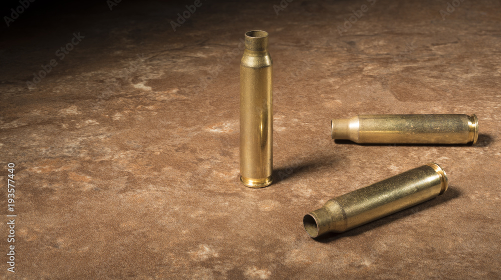 Three empty AR-15 rounds on the floor Three empty AR-15 rounds on the floor