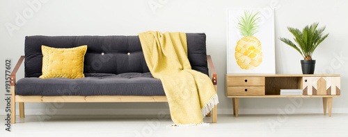 Yellow living room with poster