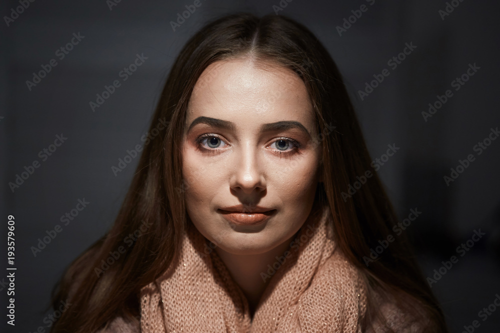 close-up portrait of beautiful girl in studio on black background. close-up portrait of beautiful girl in studio on black background.