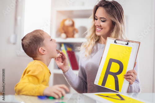 Speech therapist teaches the boys to say the letter R photo