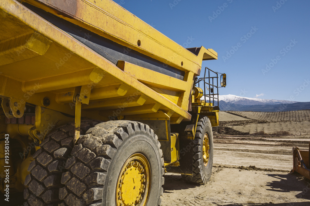 Dumper trucks parked on a construction site. Dumper trucks parked on a construction site.