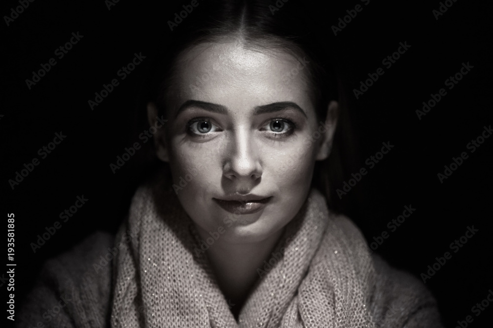 close-up portrait of beautiful girl in studio on black background. close-up portrait of beautiful girl in studio on black background.