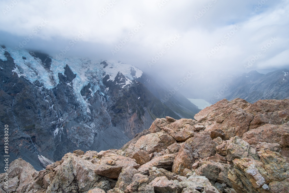 View of rocky and cliff mountain with snow in high mountain in Mt Cook national park (Muller hut track)