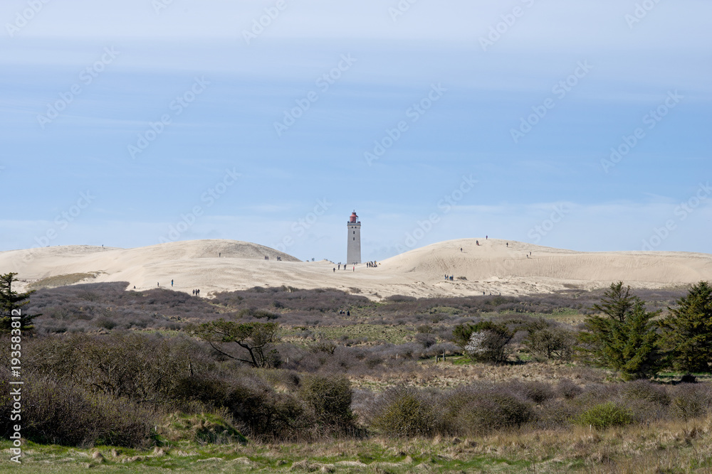 Lighthouse between dunes in denmark