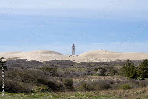 Lighthouse between dunes in denmark © Gert