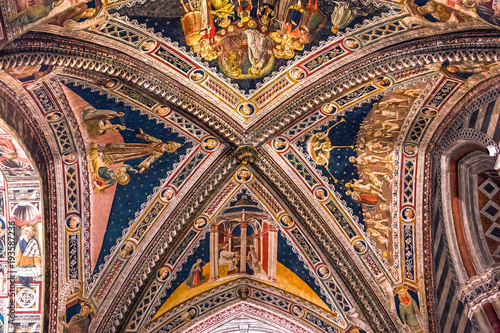 interiors and decors of the baptistery, Siena, Italy photo