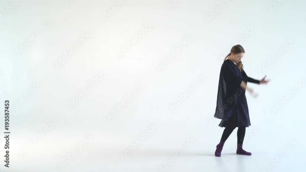 young graceful woman dancing modern dance on white background. Wide classical movements in modern variety production. contrast video black and white colors. Contemporary 4k young graceful woman dancing modern dance on white background. Wide classical movements in modern variety production. contrast video black and white colors. Contemporary 4k