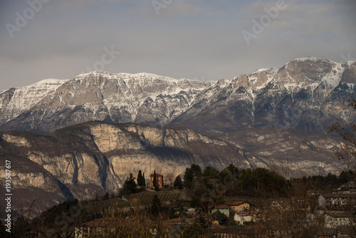 Alpine town village Povo Trento in winter light rural italian houses