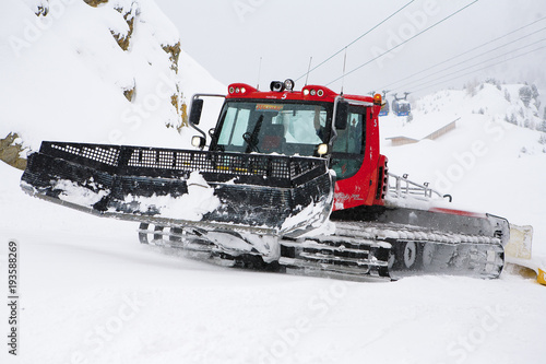 Snow plow in mountain ski resort