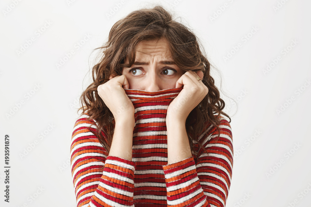 Ταπετσαρία Indoor shot of good-looking caucasian woman hiding in sweater and looking aside