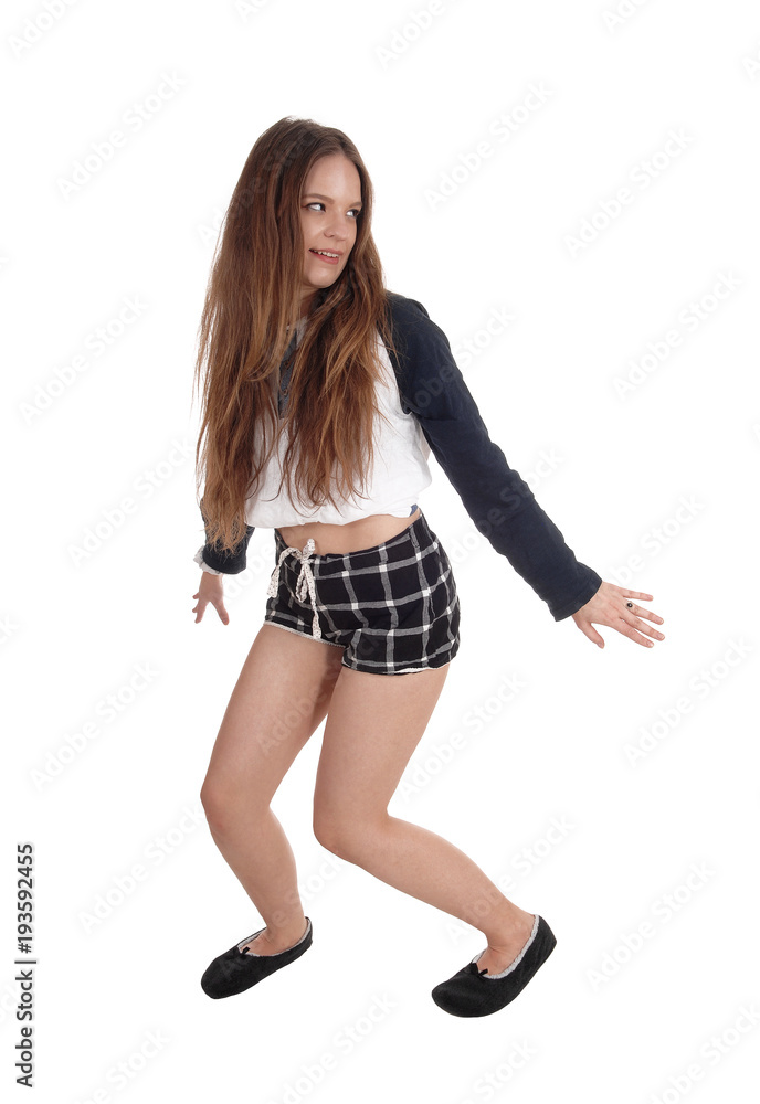 Woman dancing in checkered shorts Woman dancing in checkered shorts