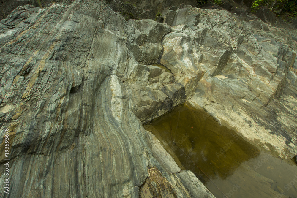 Naklejka premium part of the rock surface in the waterfall area