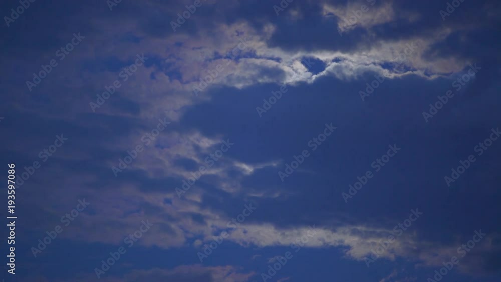 Mysterious moon hiding behind clouds, shining brightly in dark night sky, dreams Mysterious moon hiding behind clouds, shining brightly in dark night sky, dreams