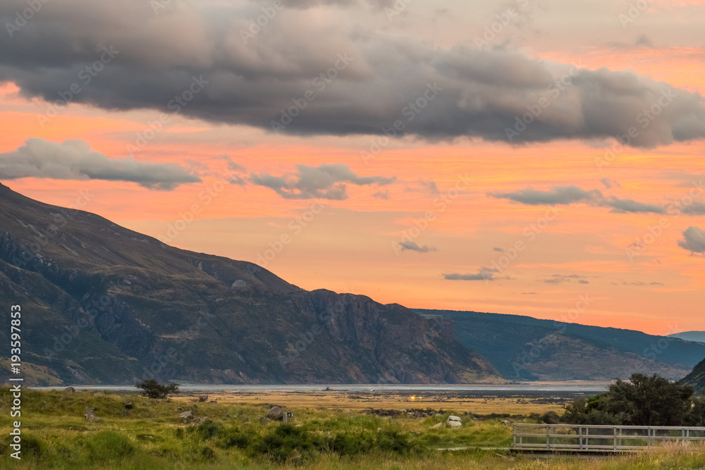 High ISO shot, Beautiful scene at sunset in Mt Cook National Park with orange and yellow sky with Cloudy