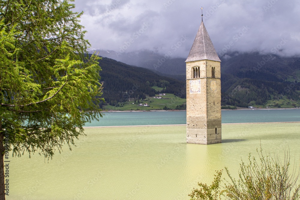 Tower of sunken church in Resia lake, Italy