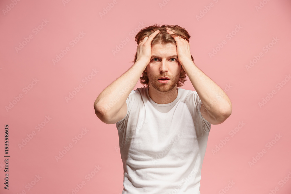 man having headache. Isolated over pink background. man having headache. Isolated over pink background.