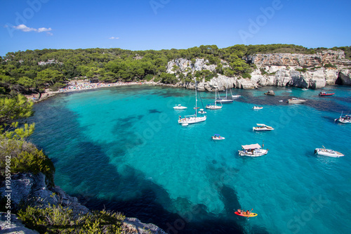 Fototapeta Naklejka Na Ścianę i Meble -  Boats and yachts on Macarella beach, Menorca, Spain