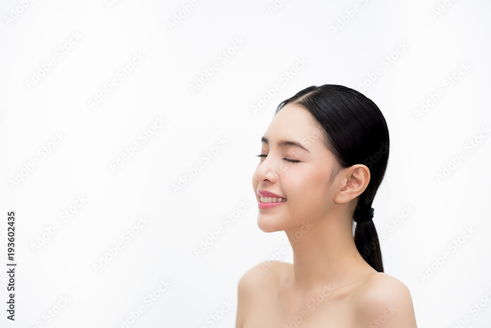 Happy young beautiful and elegant Asian woman in side view isolated over white background, Healthcare and Skincare concept.