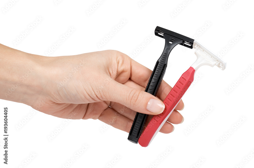 Disposable shaving razor blade in hand. Isolated on white background. Personal hygiene accessory, sharp blades Disposable shaving razor blade in hand. Isolated on white background. Personal hygiene accessory, sharp blades