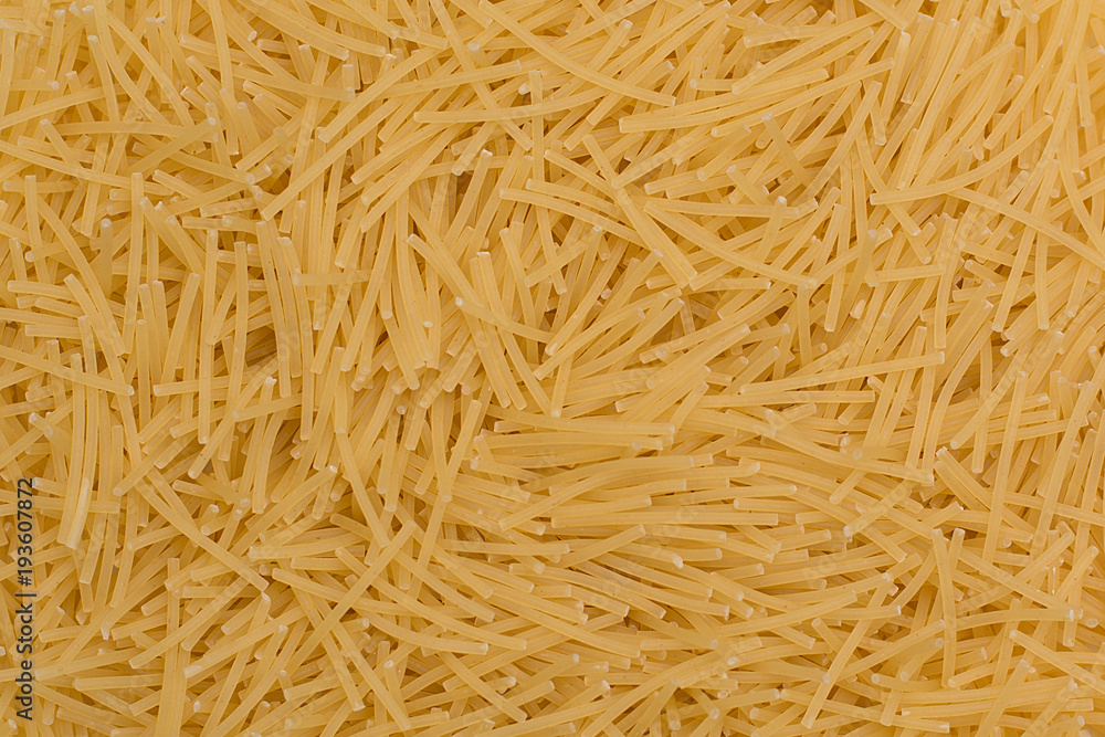 Raw fusilli pasta from durum wheat. Food background. Raw fusilli pasta from durum wheat. Food background.