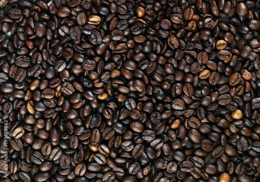 Roasted coffee beans as background. Top view. Roasted coffee beans as background. Top view.