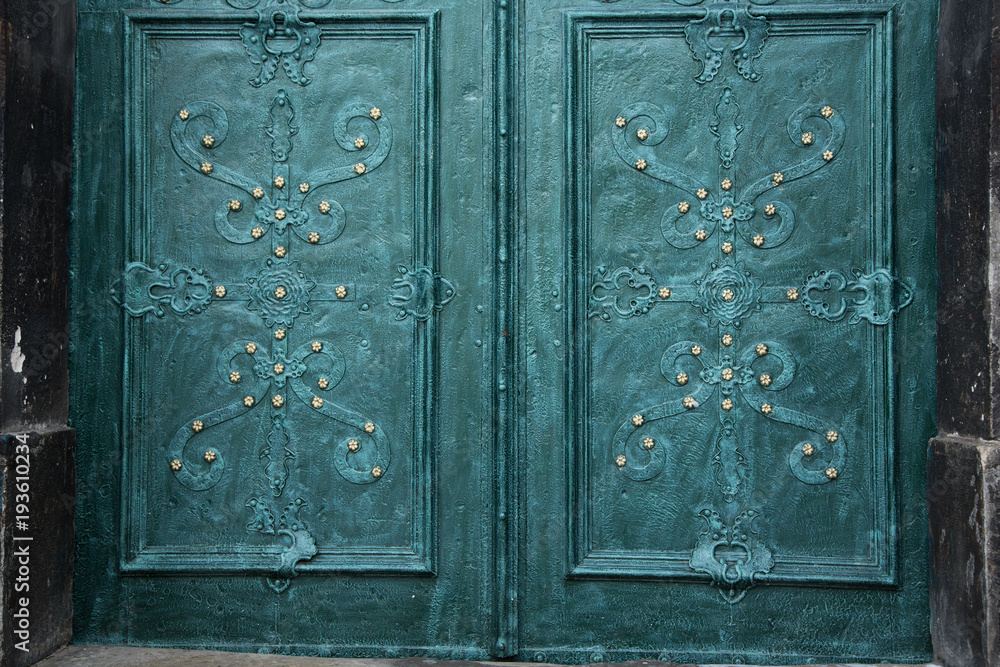 Turquoise Weathered metal cathedral door textured pattern background Turquoise Weathered metal cathedral door textured pattern background