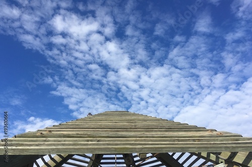 winter clouds and wooden gazebo