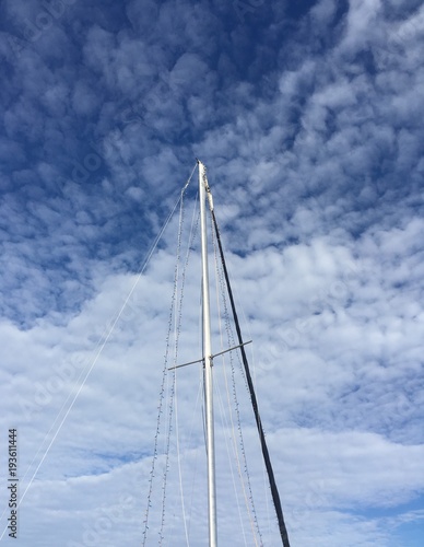 winter sky with clouds and sailboat pole