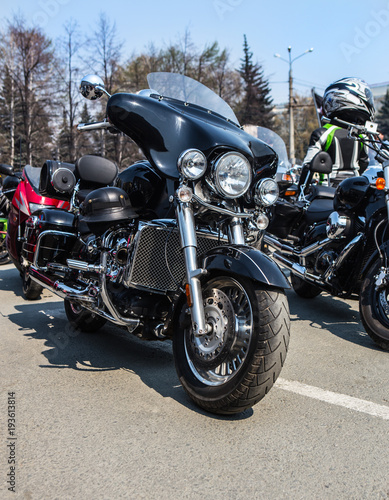  motorcycles on parking on asphalt