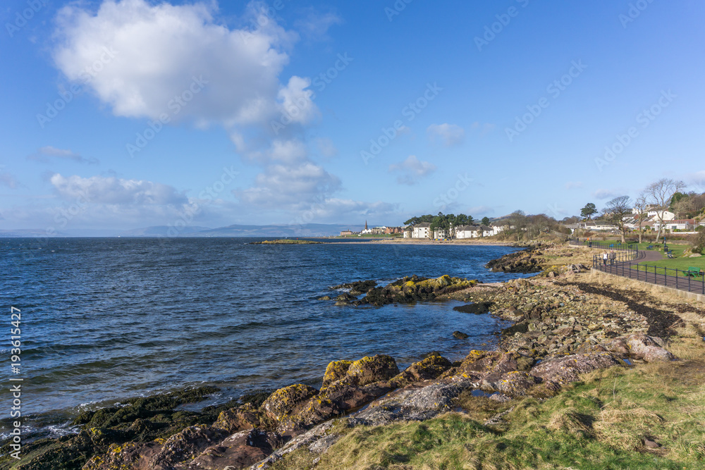 The town of largs Scotland in the distance from the South shore on a cold but bright day. A good tourism image.
