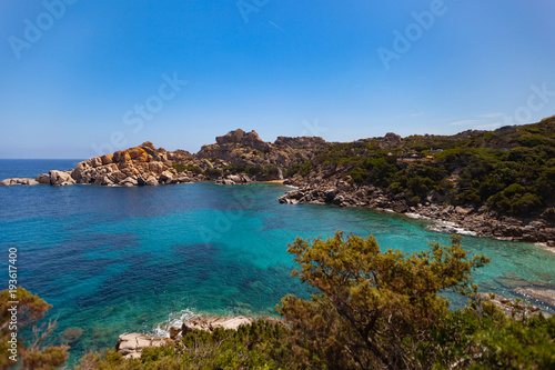 Beautiful mediterranean coastline with a blue cloudless sky, Sardinia, Italy