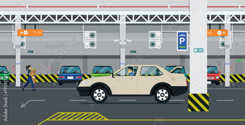 The driver is looking for parking in the building.