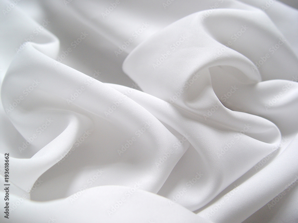 White satin fabric draped in soft waves - obrazy, fototapety, plakaty 