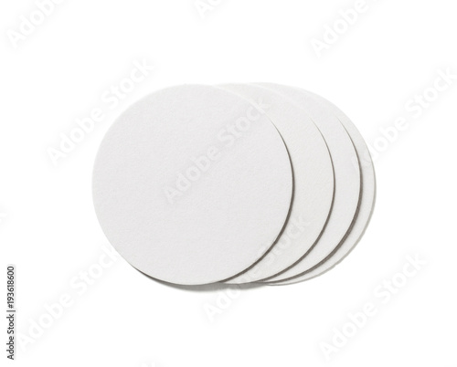 Blank beer coasters on white background. Isolated with clipping path. Flat lay.