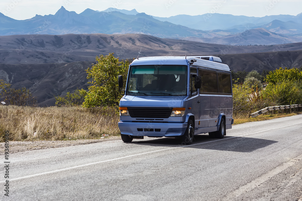 Bus drives along a road