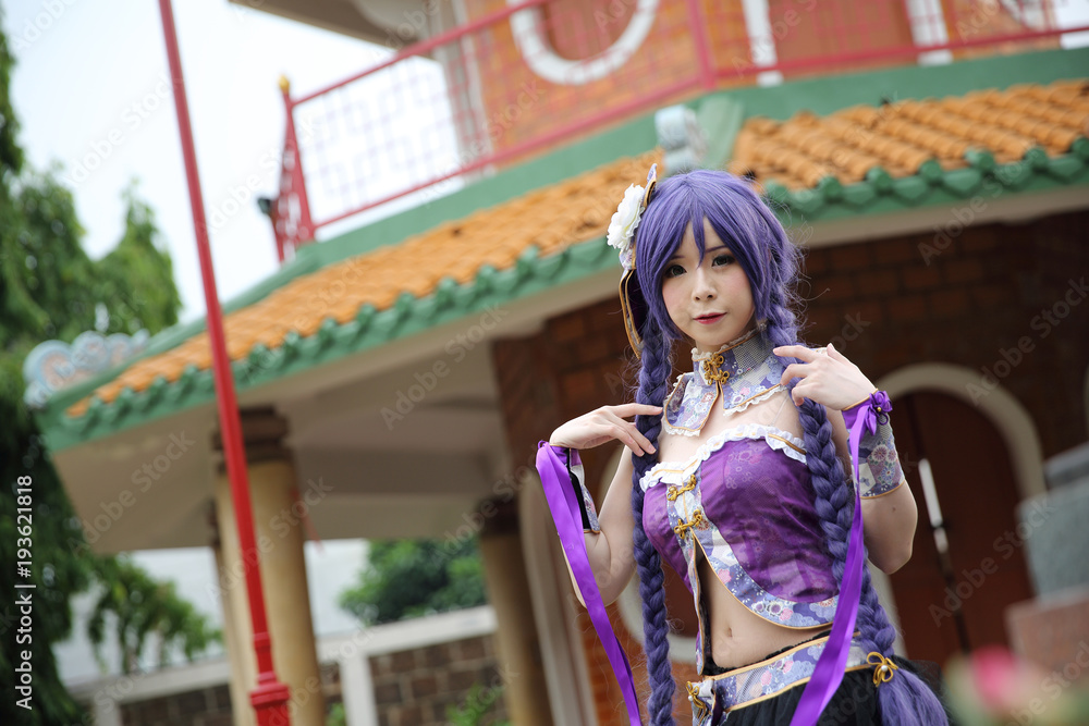 Portrait of asian young woman with purple Chinese dress cosplay with temple Portrait of asian young woman with purple Chinese dress cosplay with temple