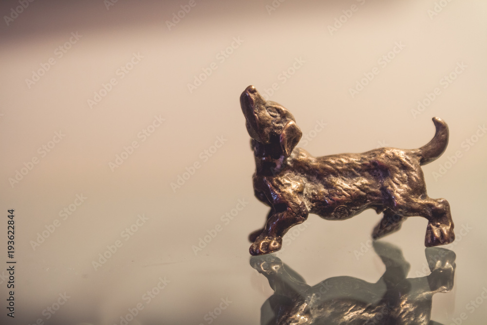 Obraz premium Miniature Silver Dog Figure