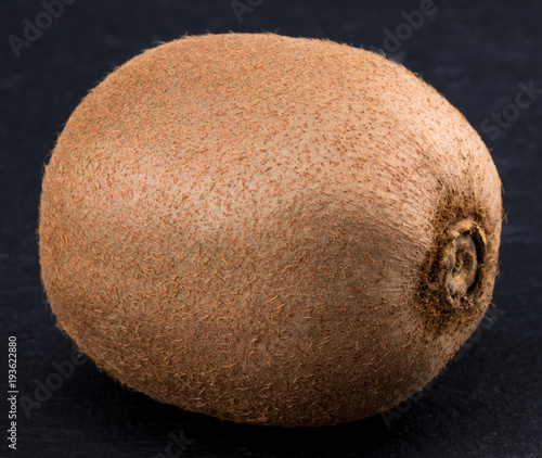 Fresh kiwi isolated on a black background. Closeup photo