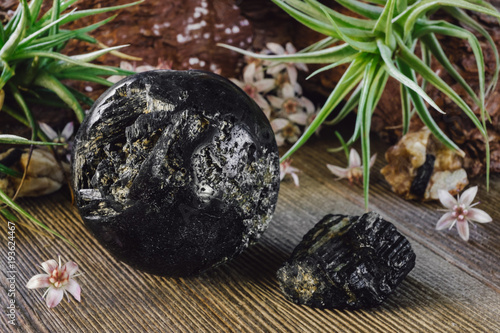 Black Tourmaline Sphere on Rustic Background