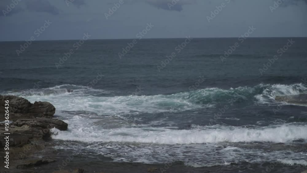 Rocky Coast slow motion shot taken at Caesarea by the sea. Oceans crash at the ruins of Caesarea by the sea also know as Caesarea Maritima Rocky Coast slow motion shot taken at Caesarea by the sea. Oceans crash at the ruins of Caesarea by the sea also know as Caesarea Maritima
