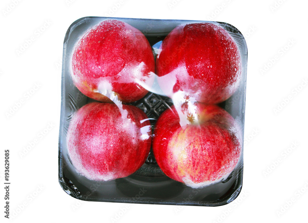 Apple wrapped in transparent plastic isolated on white background
