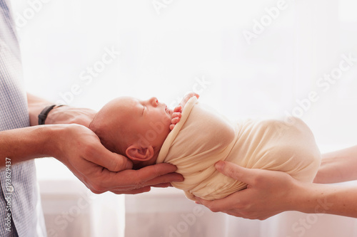 newborn baby in  hands